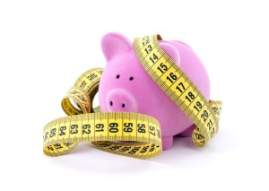 piggy bank and measuring tape
